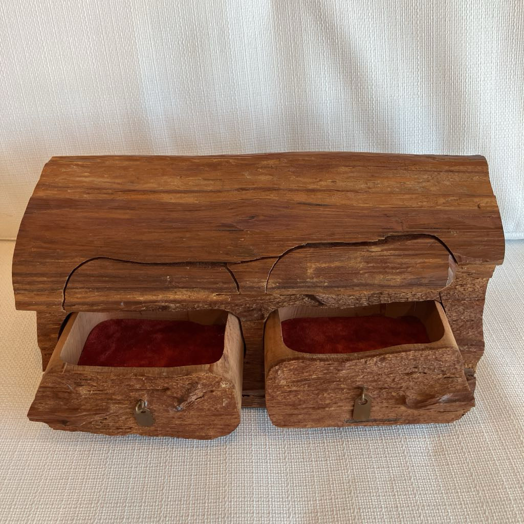 Wooden box with two drawers on a textured surface