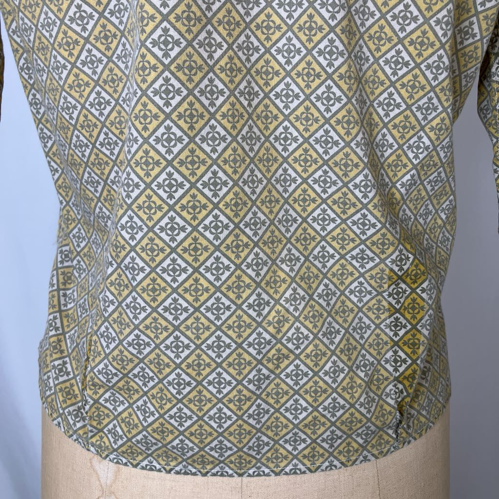 Patterned shirt on a mannequin with a blue and gray background