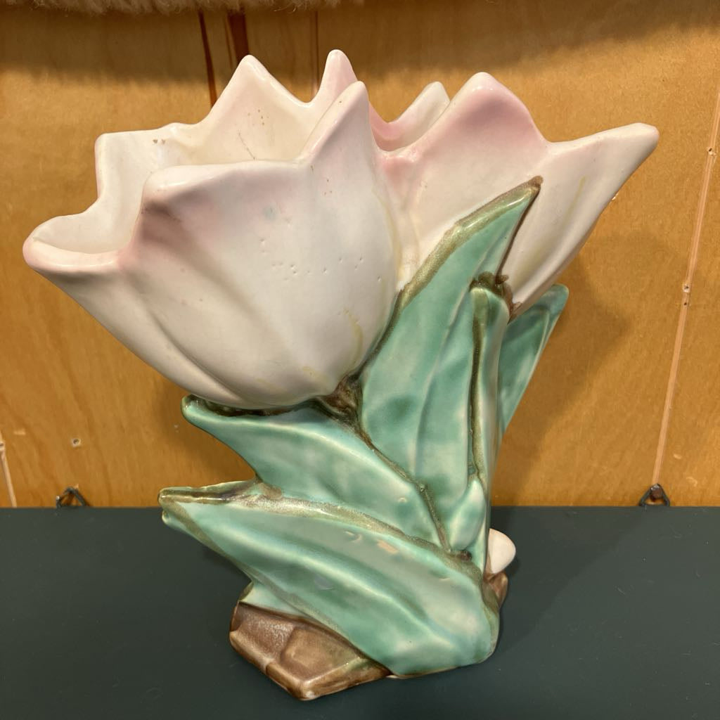 Ceramic tulip flower on a wooden surface