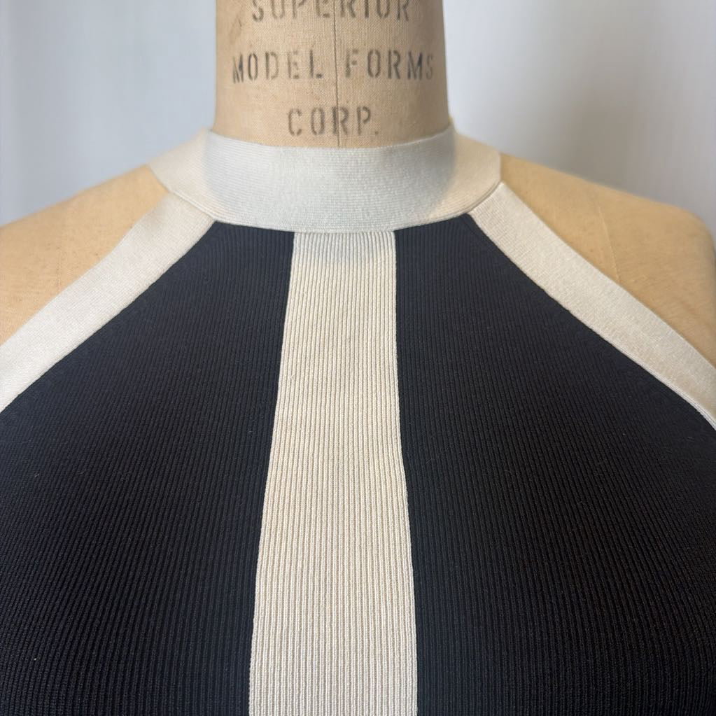 Mannequin wearing a black and beige dress with 'Superior Model Forms Corp.' label.