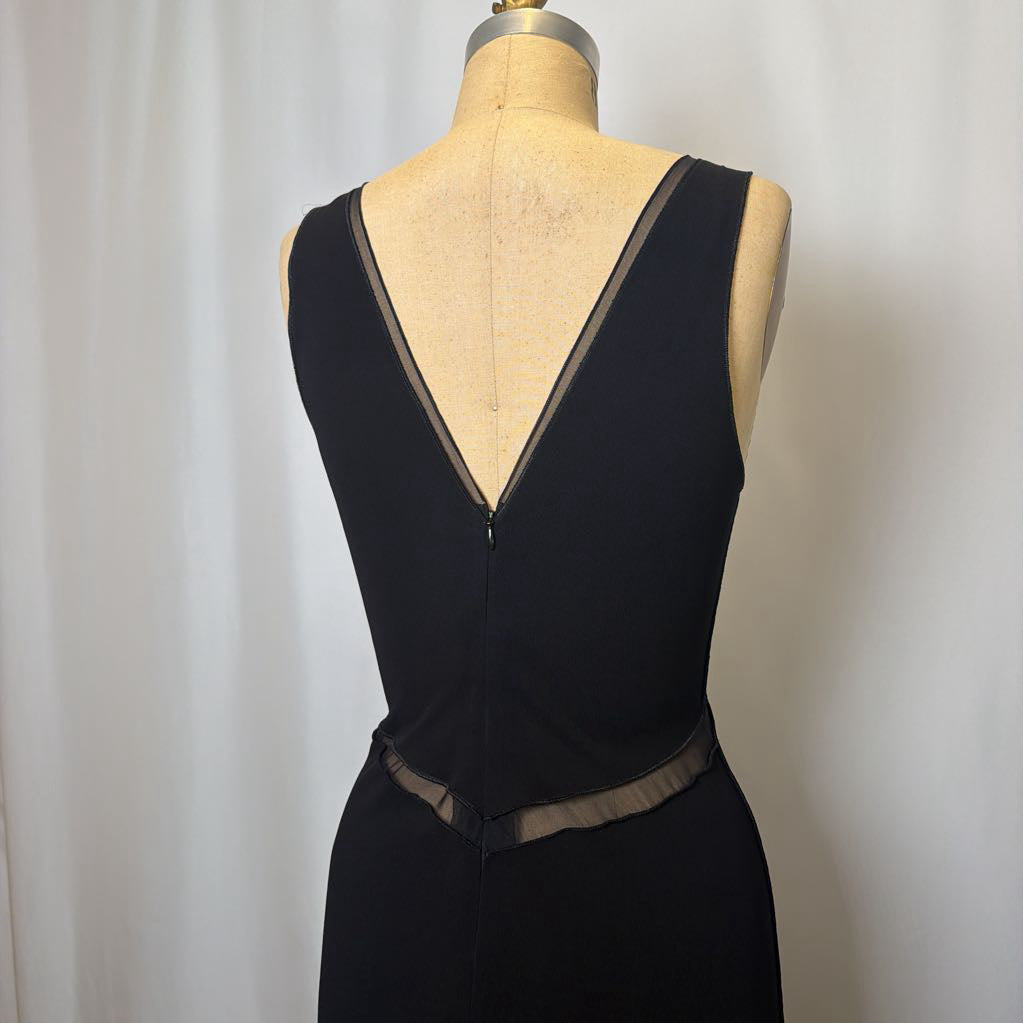 Black dress on a mannequin against a white background