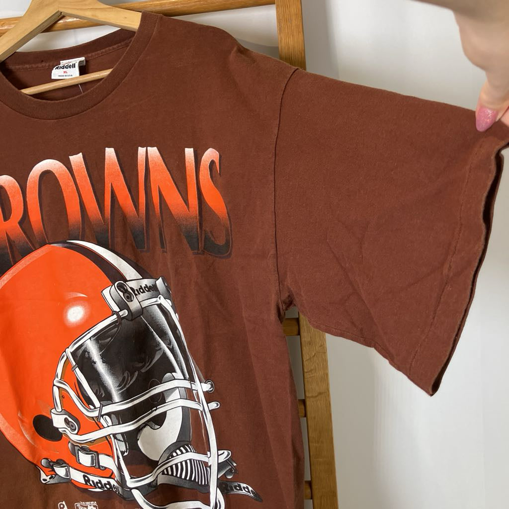Brown t-shirt with football helmet graphic and 'Browns' text on a hanger.