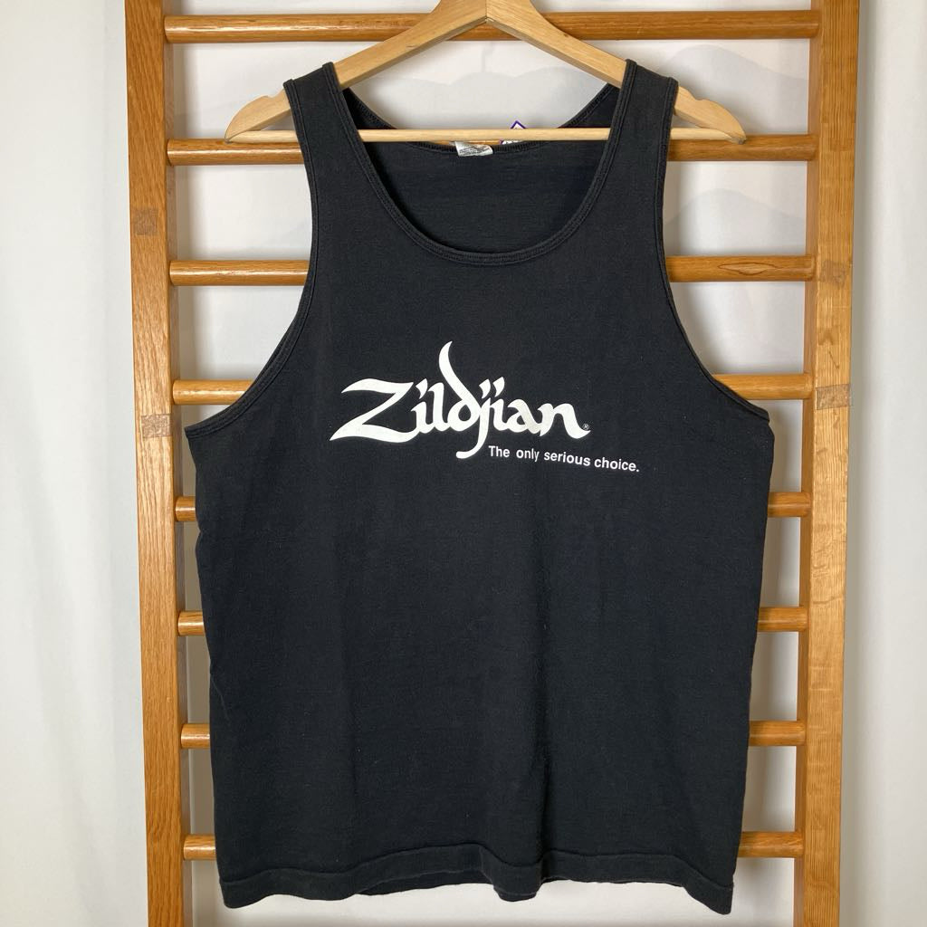 Black tank top with 'Zildjian' logo on a wooden rack