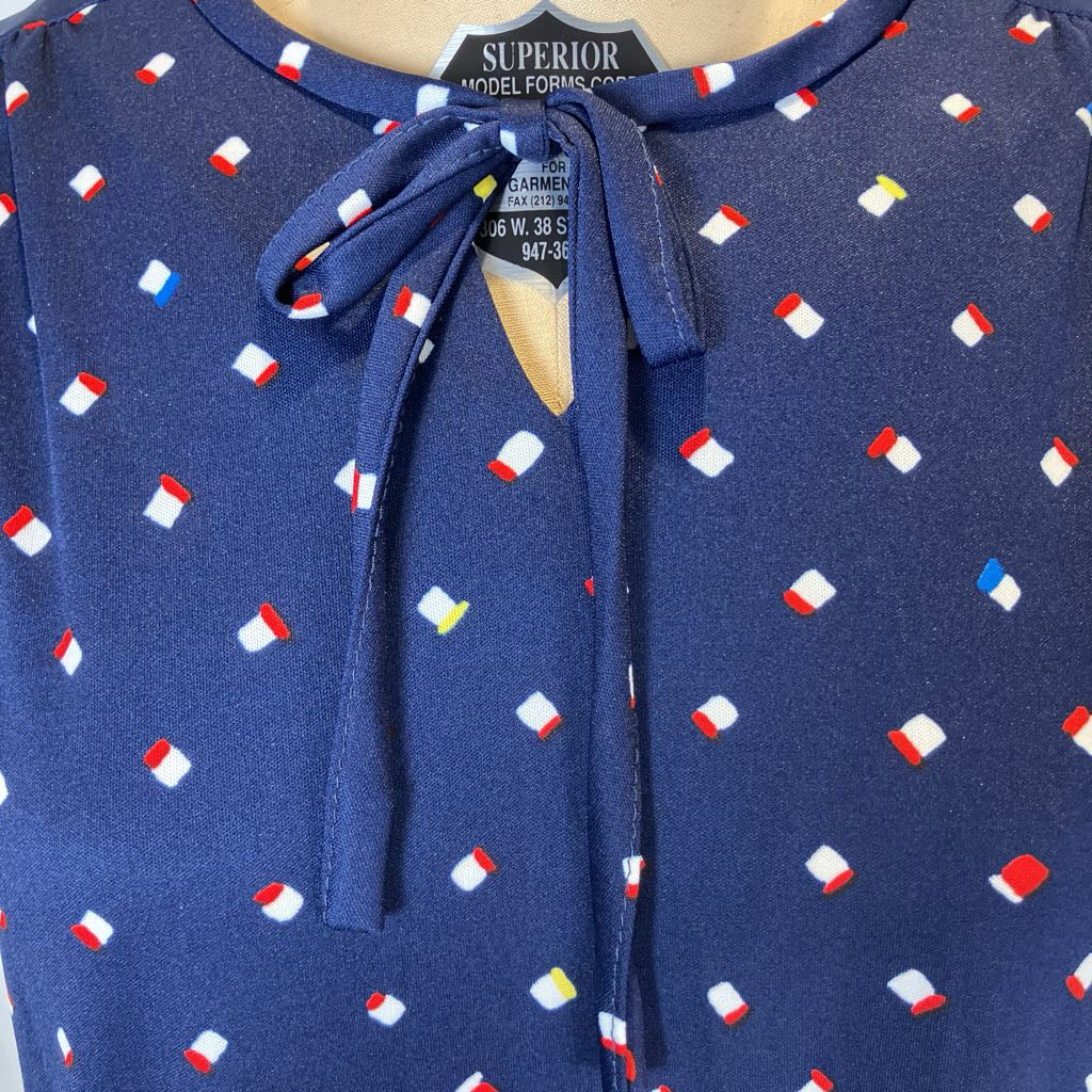 Blue dress with colorful pattern on a mannequin