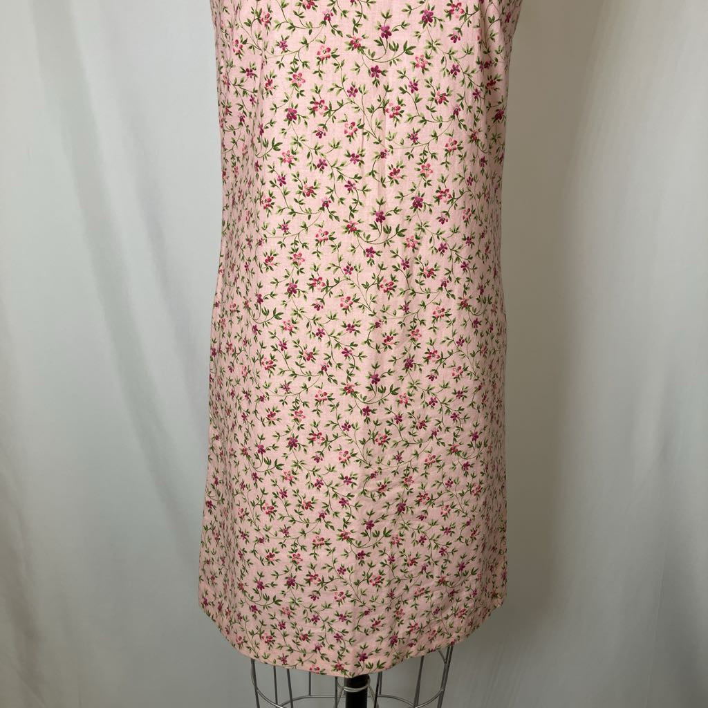 Floral dress on a mannequin against a plain background