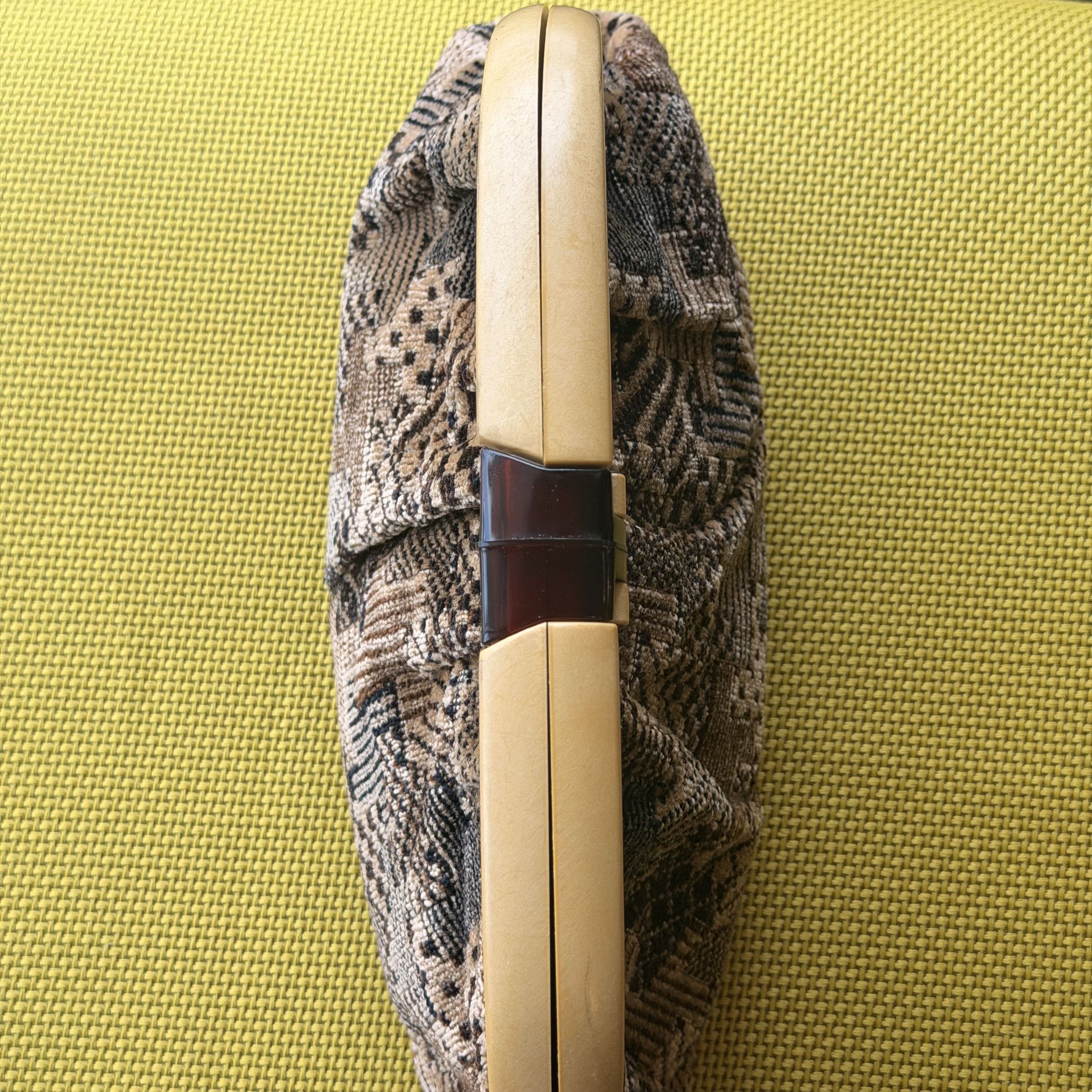 Patterned shoe on a green fabric surface