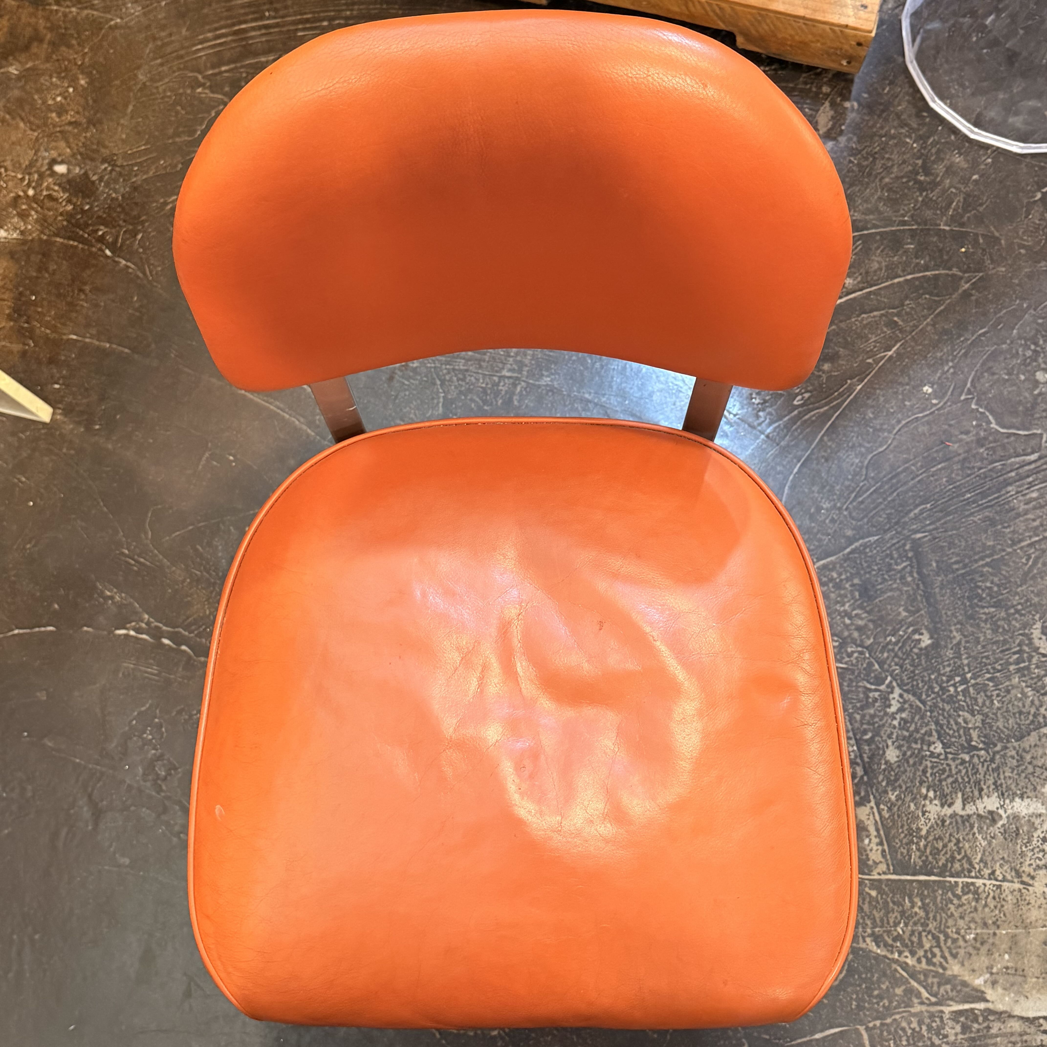 Orange chair with metal silver detailing