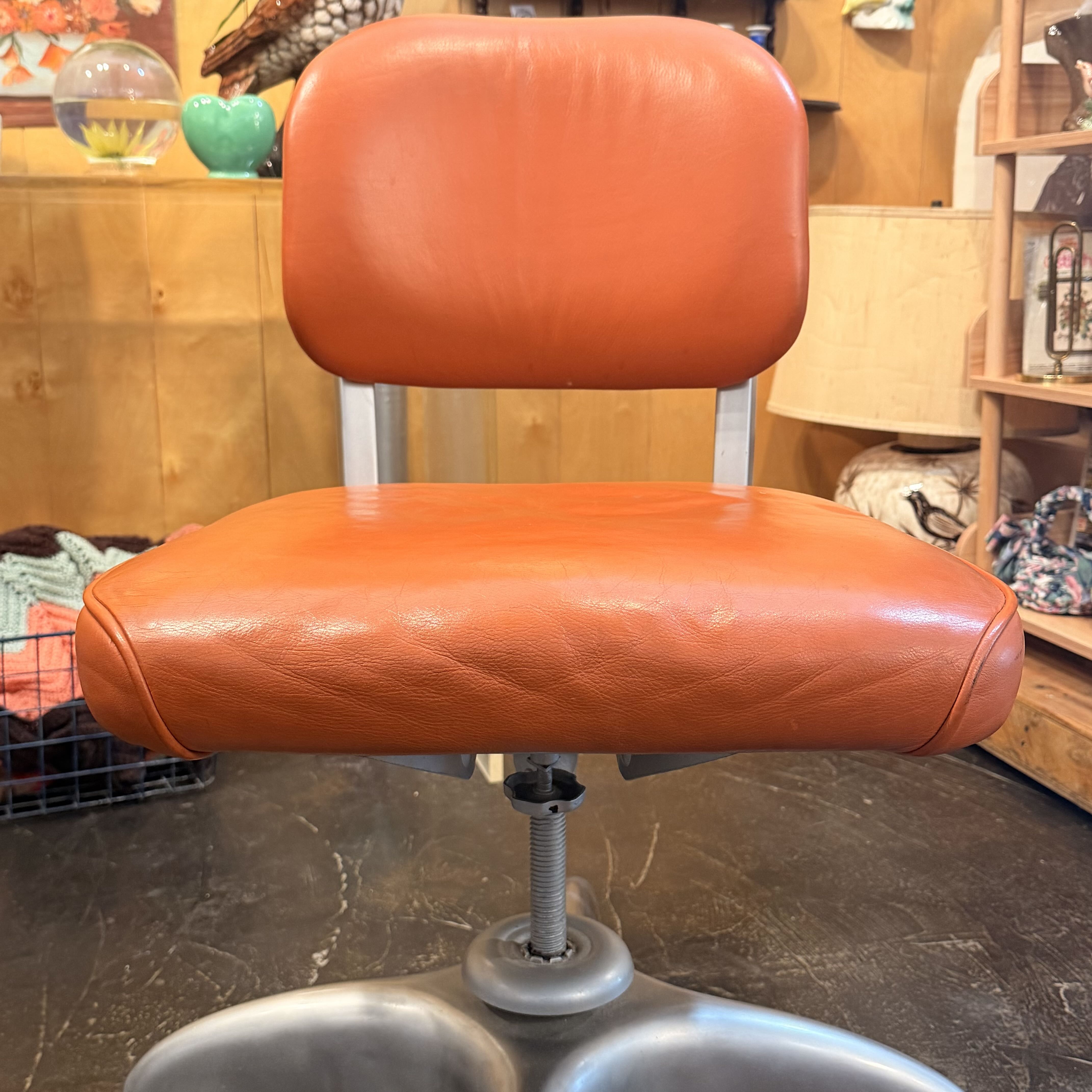 Orange chair with metal silver detailing
