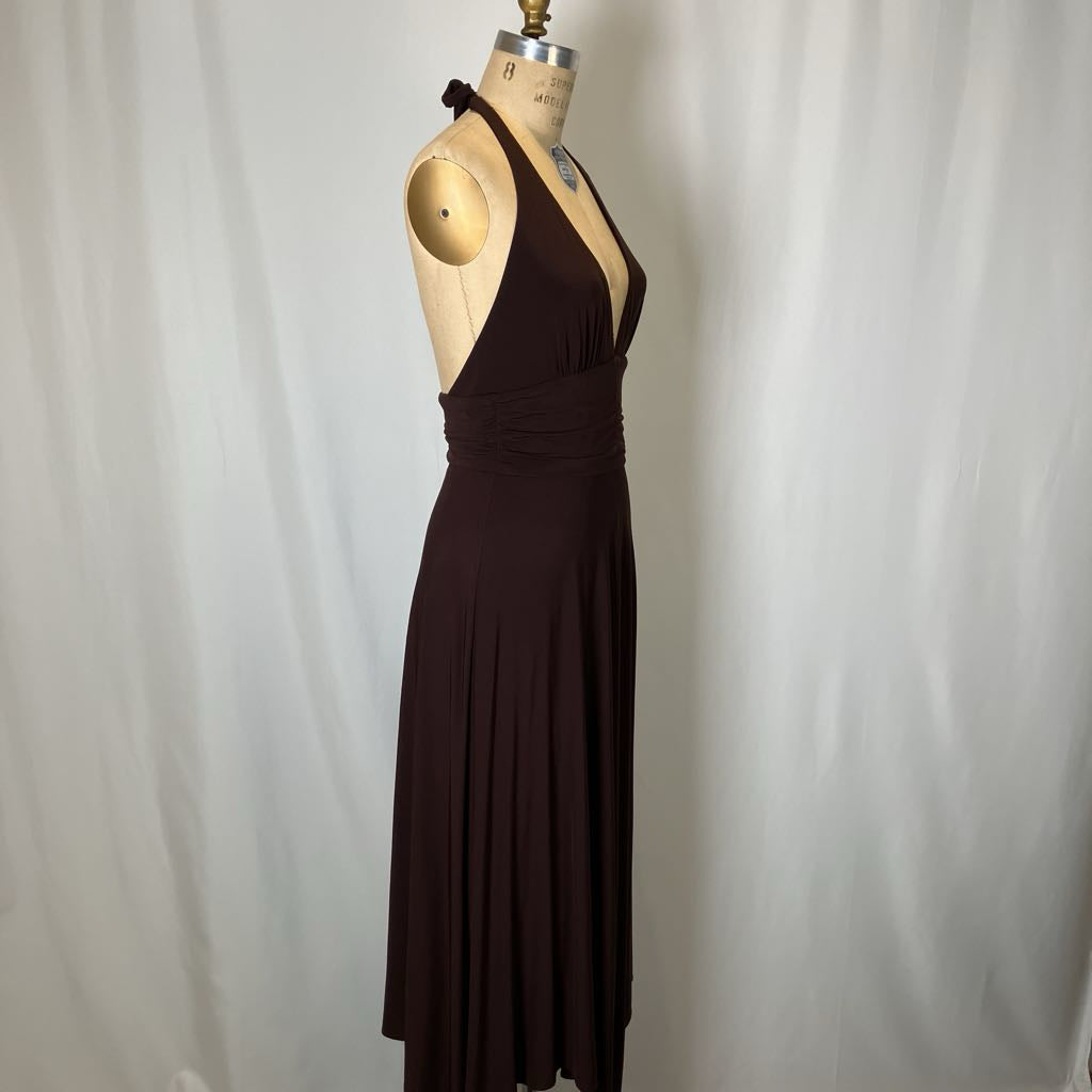 Brown dress on a mannequin against a plain background