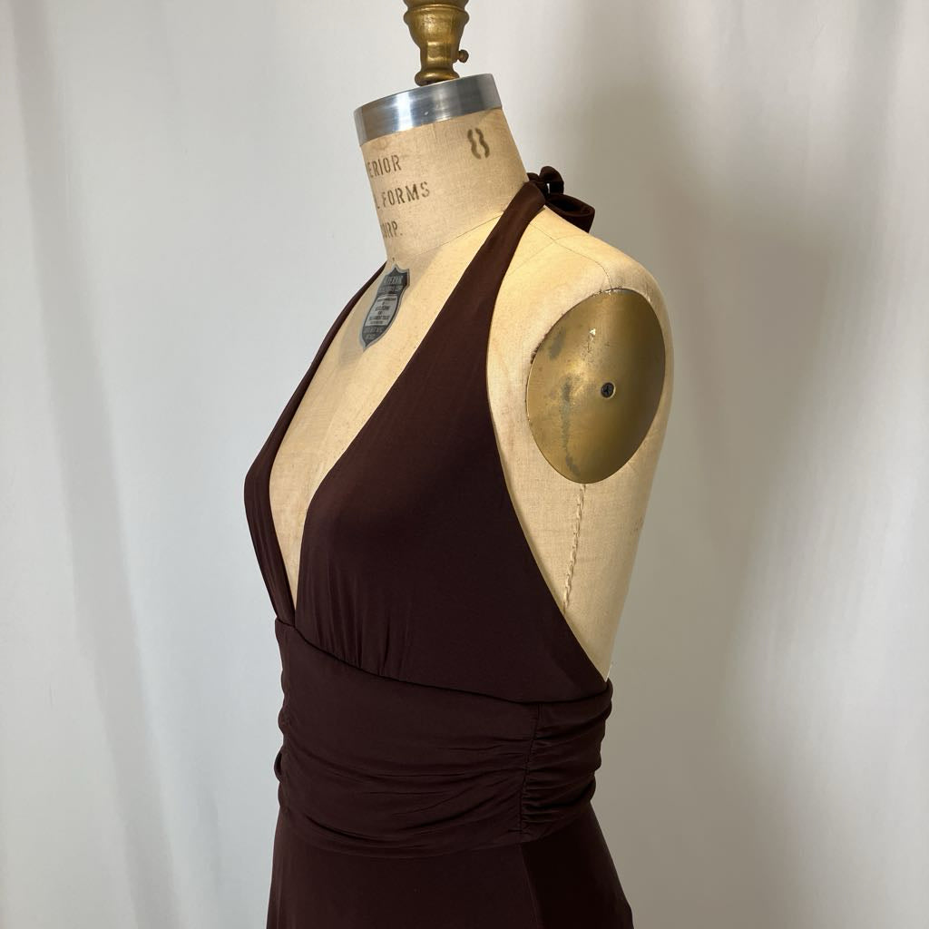 Brown dress on a mannequin against a plain background