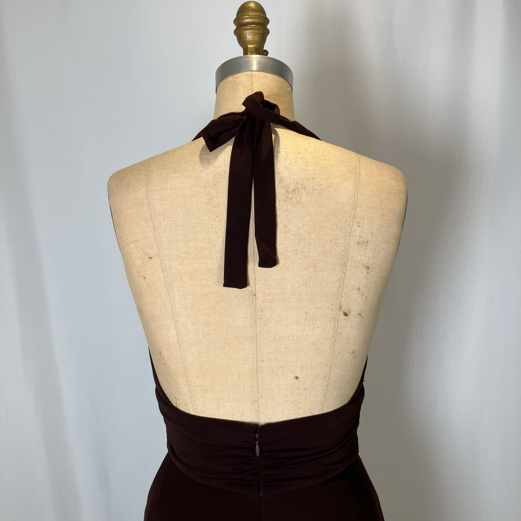 Black halter top on a mannequin with a plain background