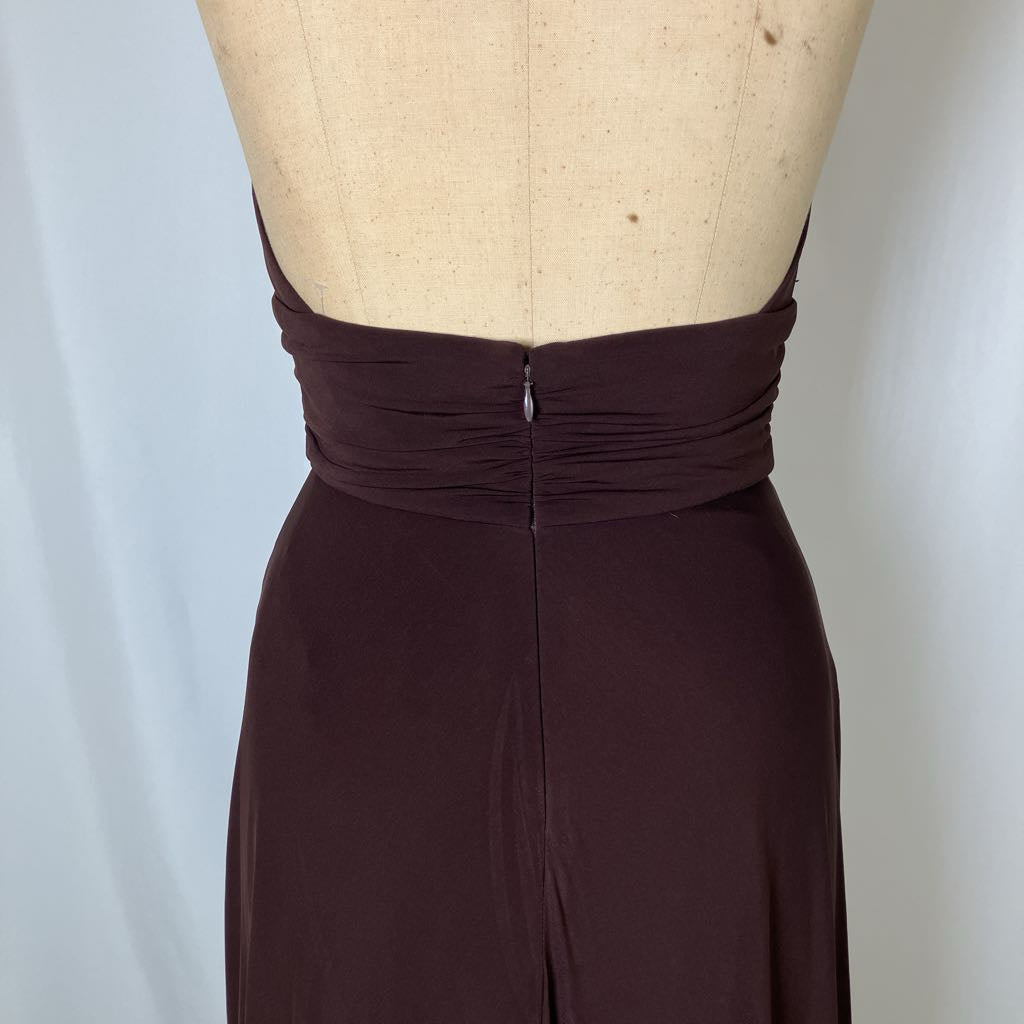 Brown dress on a mannequin against a plain background