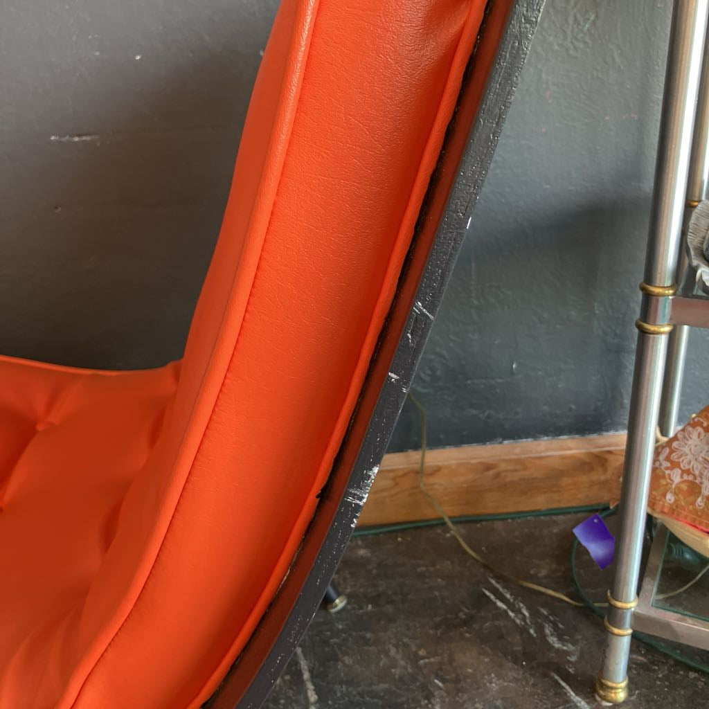 Some vintage wear on the side of the chair 