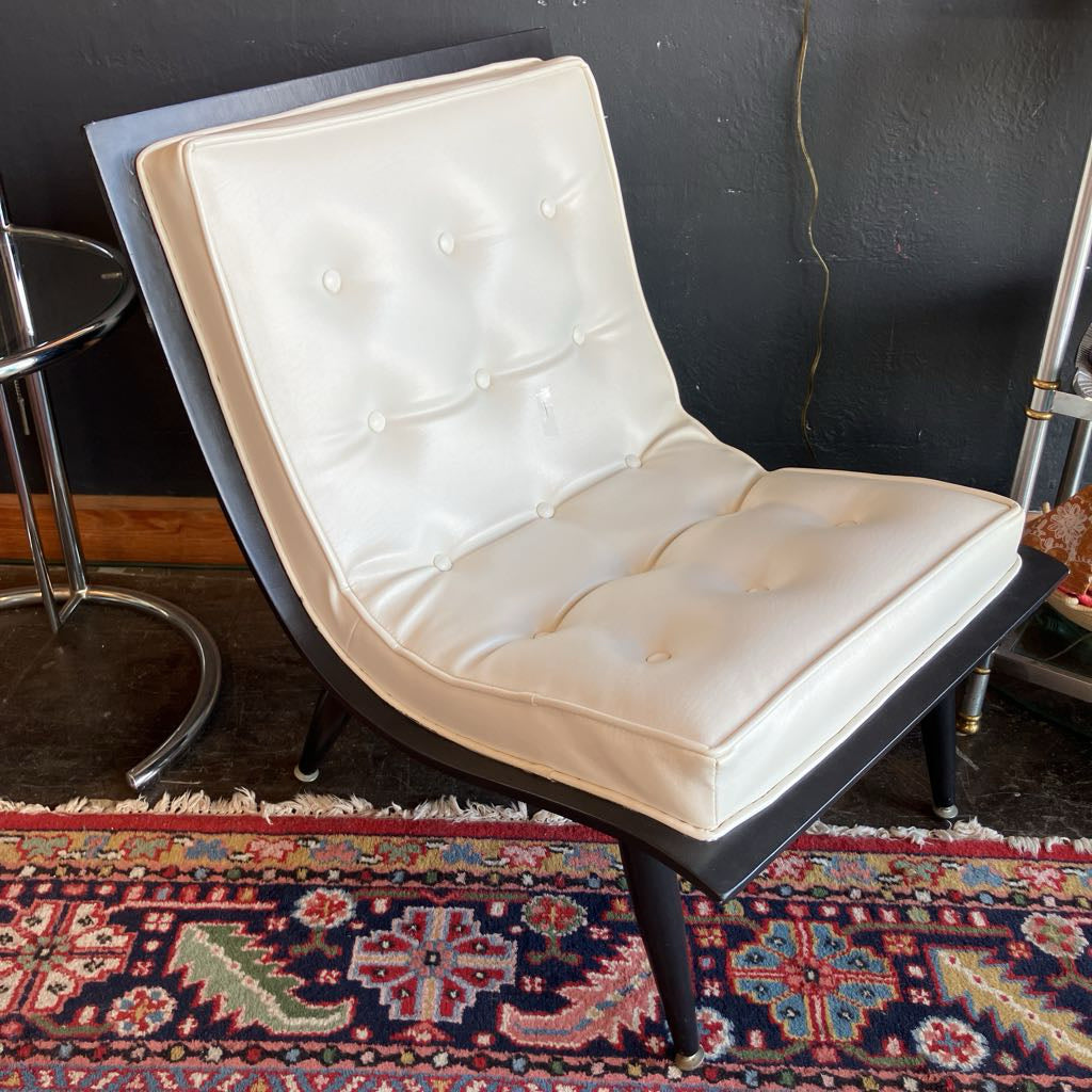 White mcm tufted vinyl scoop chair with walnut wood frame  that has been painted black 