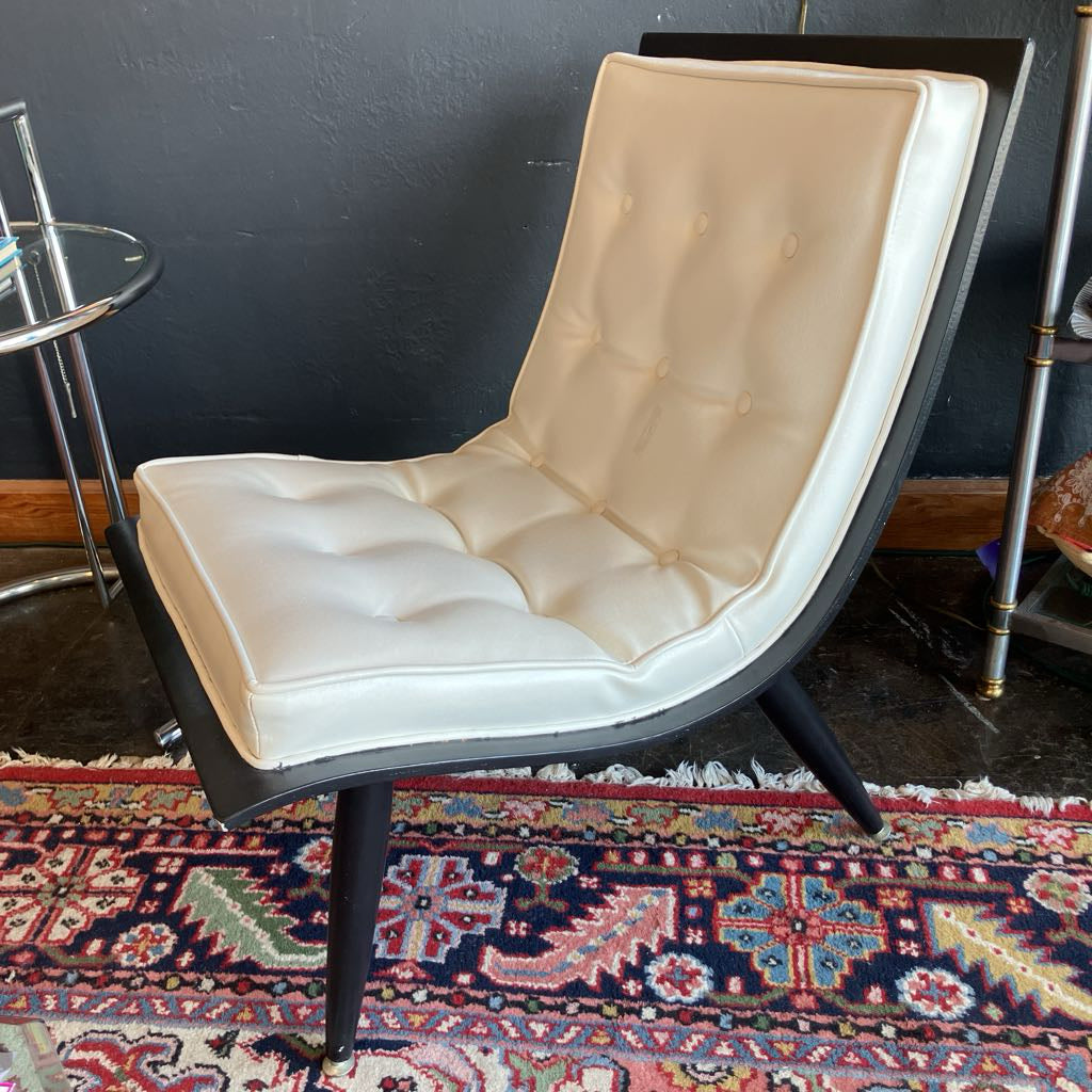 White mcm tufted vinyl scoop chair with walnut wood frame  that has been painted black 