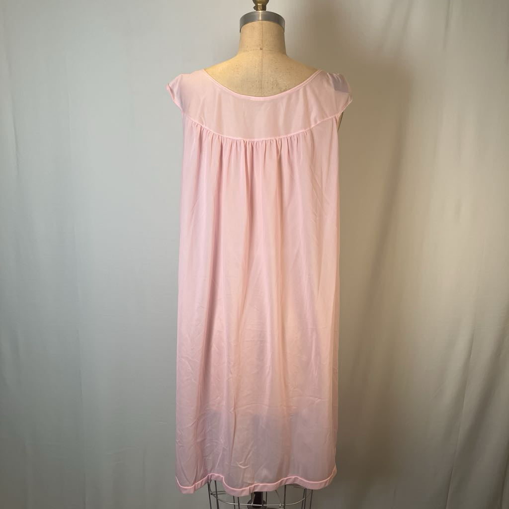 A light pink sleeveless nightgown displayed on a dress form mannequin against a light gray fabric backdrop.