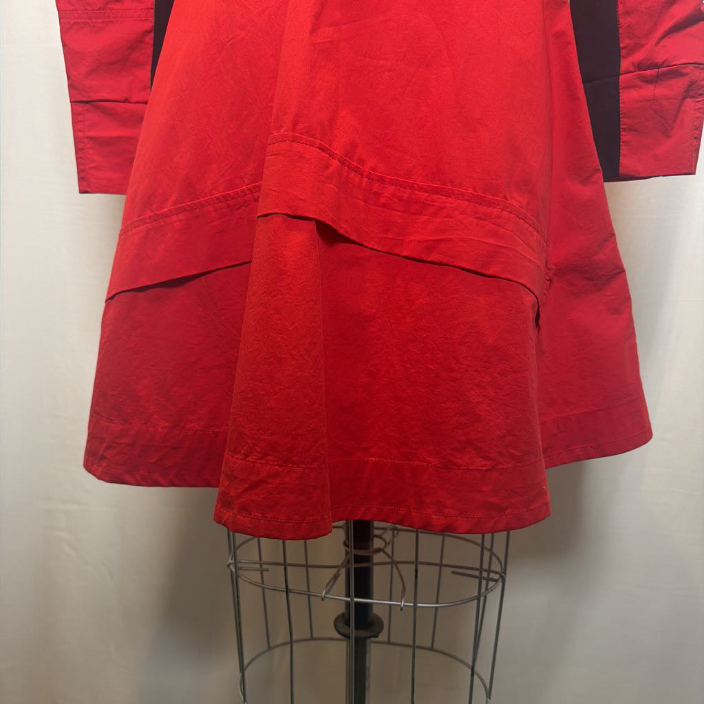 A bright red garment, likely a kimono or robe, displayed on a wire dress form mannequin against a plain off-white background.