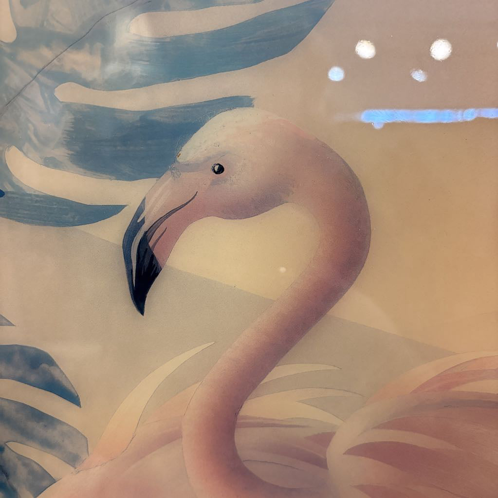 A close-up of a pink flamingo illustration or mural, showing the bird's curved neck, black-tipped beak, and soft beige and blue background with leaf-like shapes.