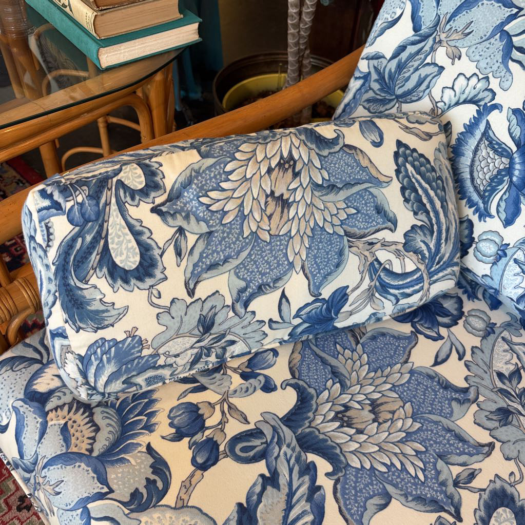 Blue and white floral upholstery on a sofa.  