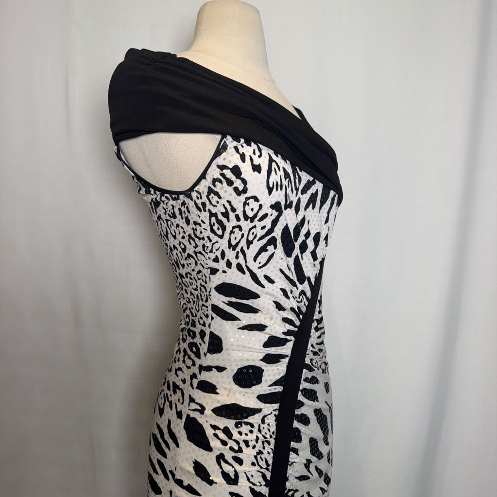 A black and white patterned off-the-shoulder dress displayed on a beige mannequin torso against a light gray fabric backdrop.