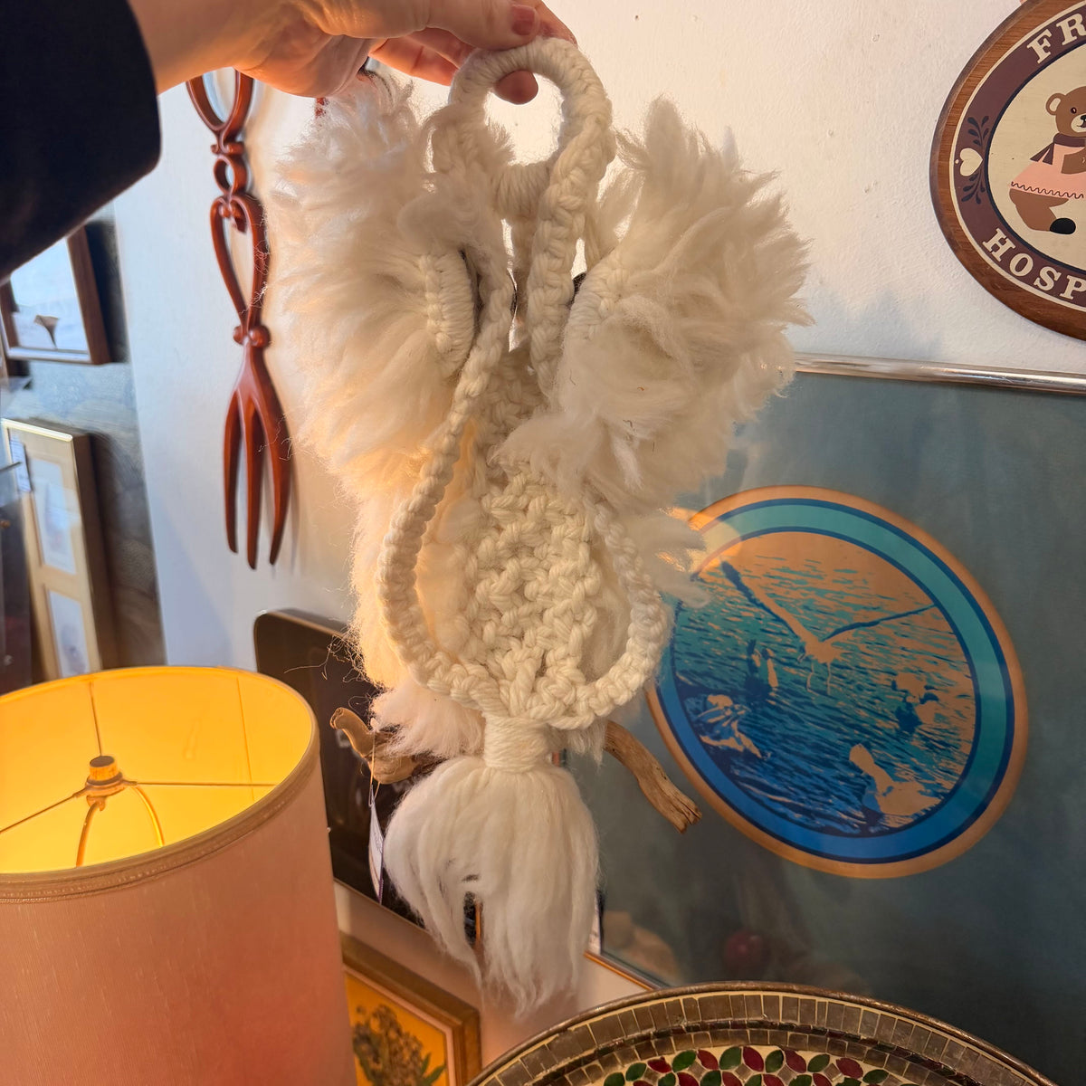 back of 1970's Wall Hanging Owl held by a hand